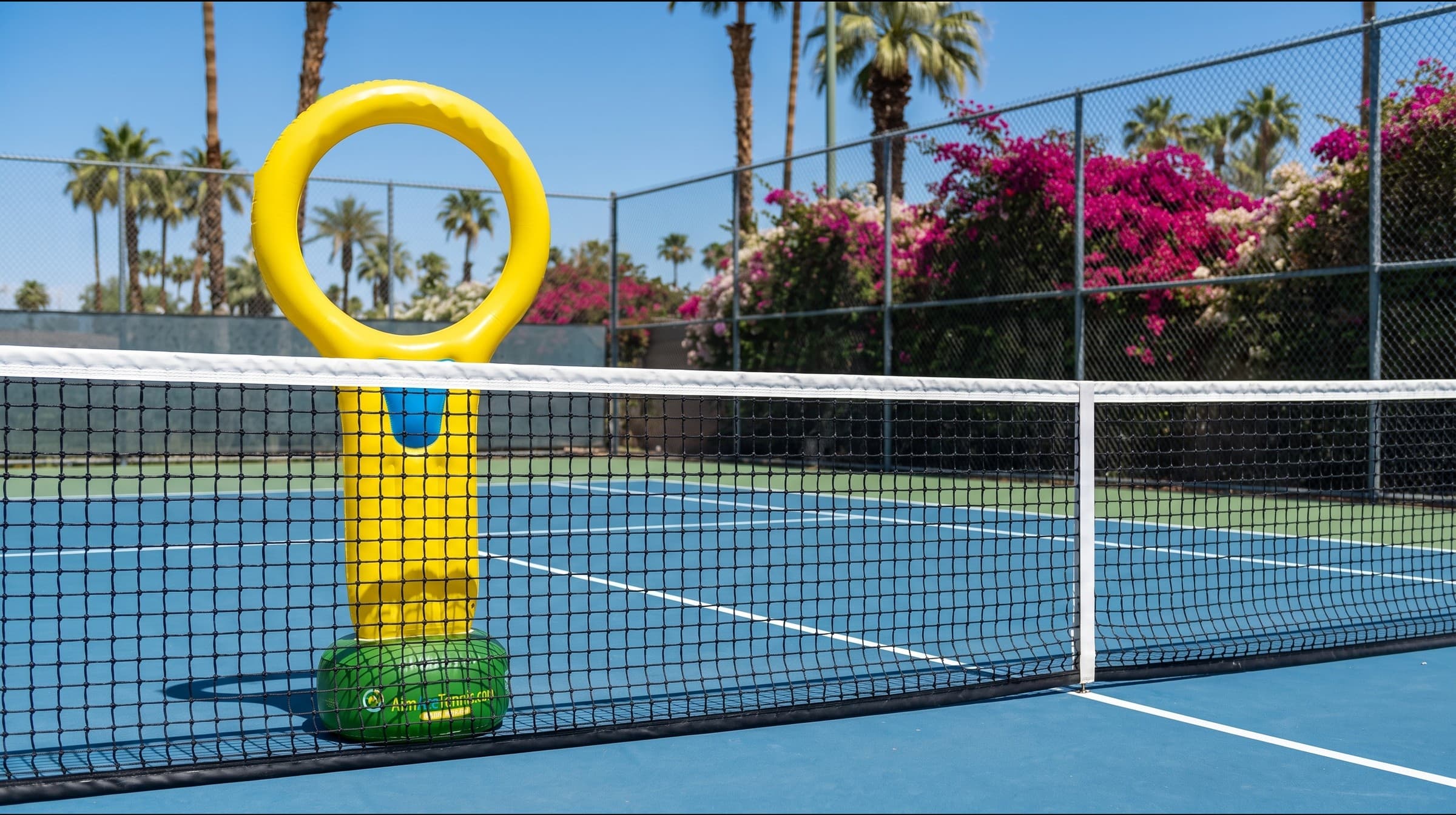 AimAce target on a tennis court behind the net